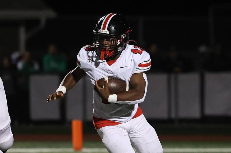 Lincoln-Way Central’s Justin Cobbs rushes to the outside against Providence on Friday, Sept. 6, 2024 in New Lenox.