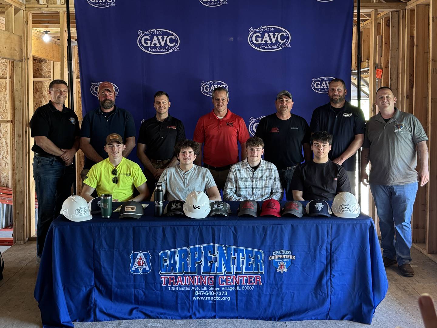 (Front) Owen Noon, Sean Lewis, Aaron Maxwell and Blake Ness with their GAVC instructors, union representatives and representatives from Narvick Bros. Construction, D Construction, and Vissering Construction.