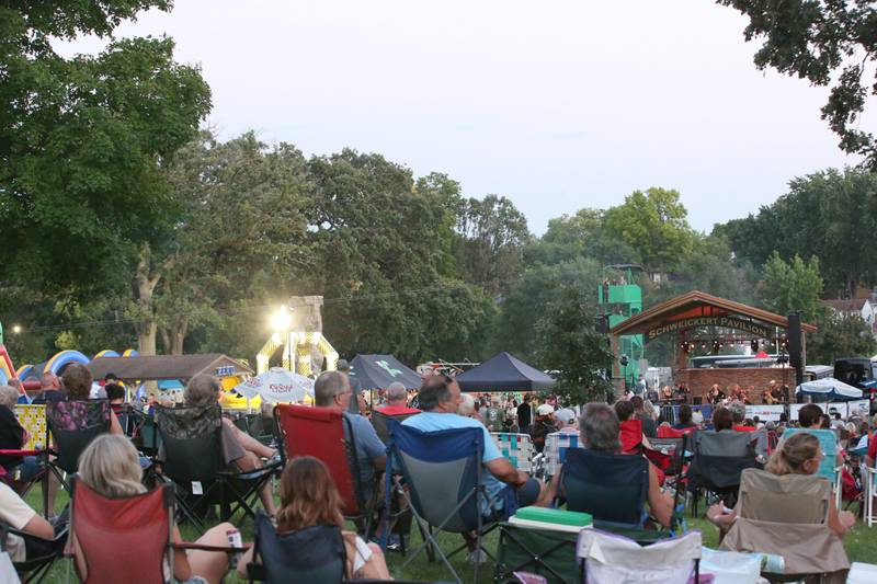 A large crowd watches the World Turning Band, a Fleetwood Mac tribute band perform during the Taste of the Illinois Valley festival on Saturday, Aug. 3, 2024 at Centennial Park in Peru.