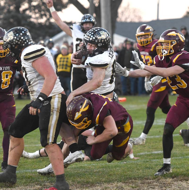 Lena-Winslow's Aiden Wild (85) dives over a Stockton player in 1A semifinal action in Stockton on Saturday, Nov. 22, 2025.