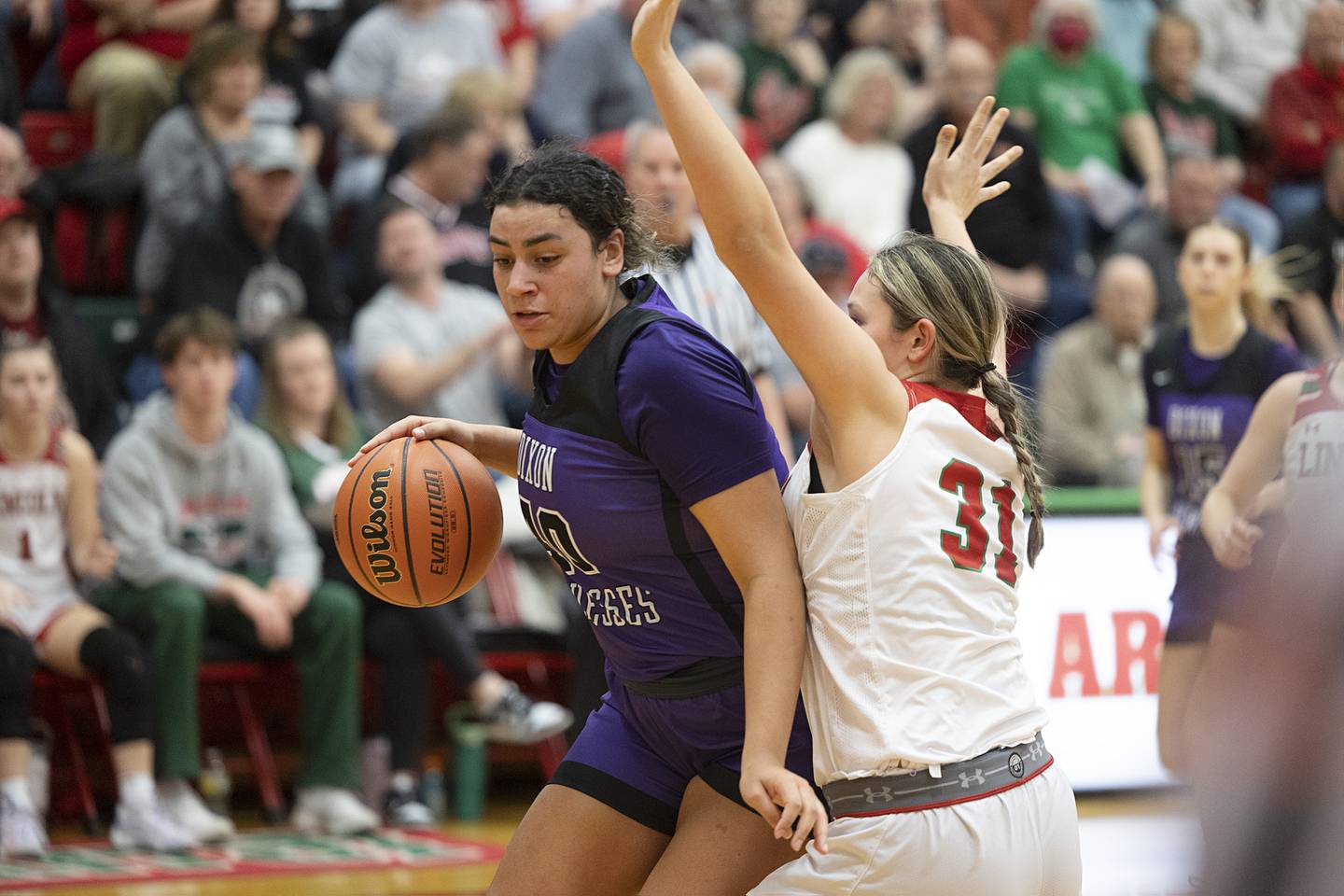 Dixon’s Hallie Williamson works against Lincoln’s Makinley Knapp in the class 3A super sectional Monday, Feb. 26, 2024 at LaSalle-Peru High School.