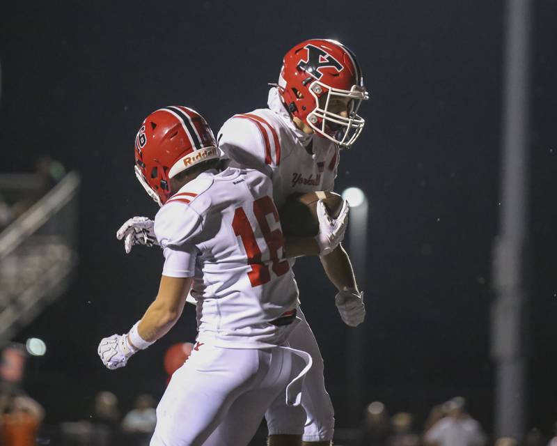 Yorkville's A.J. DiVito (9) celebrates his touchdown reception with Joel Castillo (16) during football game between Yorkville at Plainfield East Friday, Sept 19, 2025 in Plainfield.