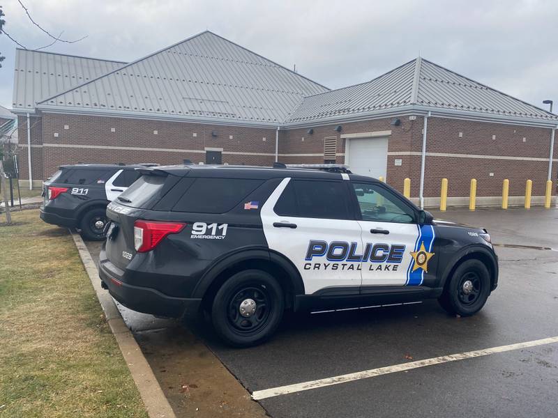 Crystal Lake police vehicles sit outside the police station on Thursday, Dec. 29, 2022.
