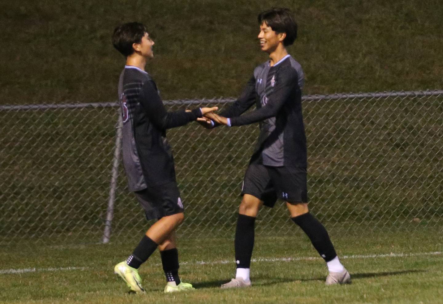 Kankakee's Yael Calderon and Angel Cruz hi-five each other after scoring a goal against Ottawa during the Class 2A Regional semifinal game on Monday, Oct. 20, 2025 at Ottawa HIgh School.