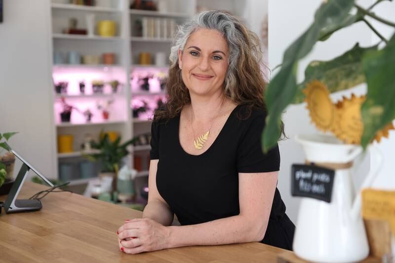 Michele Arana-Bianchi stands in her shop Internode Greenery and Home in Downtown Joliet on Thursday, April 20, 2023.