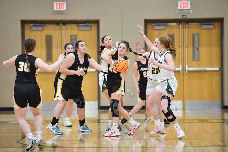 Herscher's Avery Wright battles for possession Monday, Feb. 3, 2025, during the Tigers' loss to the Coalers at Coal City High School.