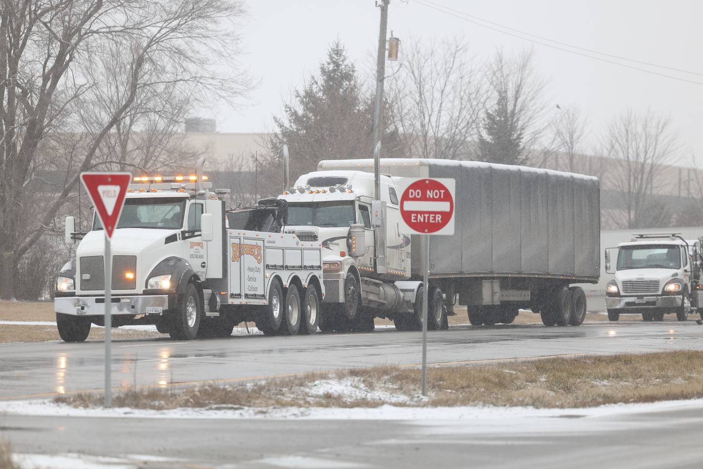 A semi truck gets ready to be towed along southbound South Chicago Street at the scene of a deadly accident killing one person involving a semi and a vehicle on Friday Feb. 16th, 2024 in Joliet.