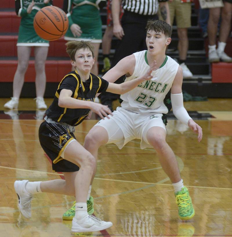A pass gets away from Riverdale’s Paxton Kiddoo as Seneca’s Brady Sheedy looks to grab during the 2nd period Friday at Regional Championship at Hall.