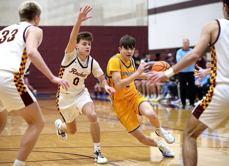 Johnsburg's Trey Toussaint drives to the basket against Richmond-Burton's Gavin Radmer during a Kishwaukee River Conference boys basketball game on Tuesday, Jan. 27, 2026, at Richmond-Burton High School.