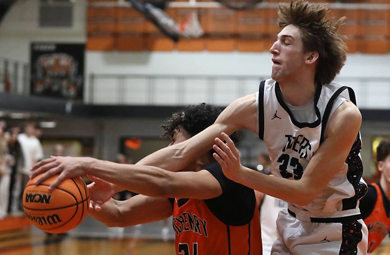 Crystal Lake Central's Grant Kuligowski (right) batltles with McHenry's Adam Anwar for a rebound during a Fox Valley Conference boys basketball game on Tuesday, February. 10, 2026, at Crystal Lake Central High School.