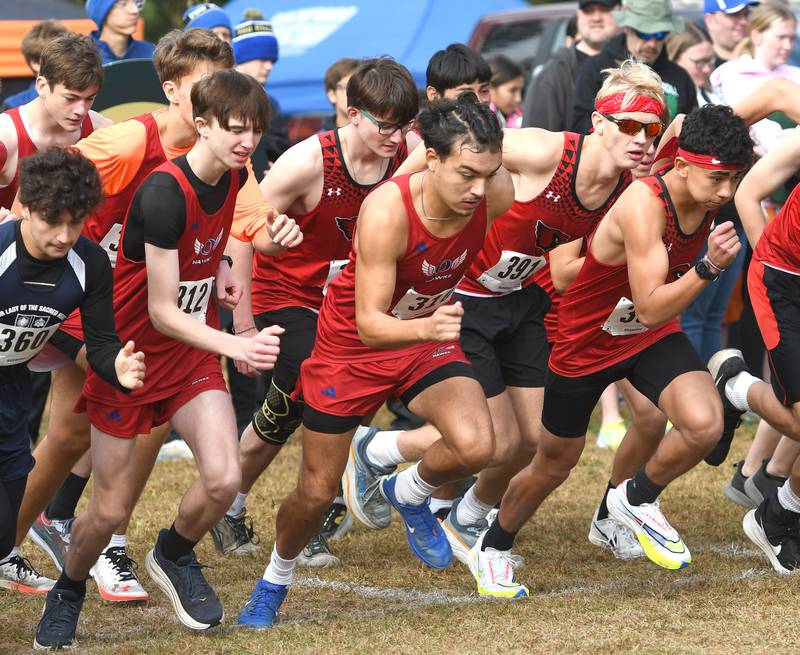 Oregon's Daniel Gonzalez (center) starts the 1A Winnebago Boys Regional on Saturday, Oct. 25, 2025 at the Levi and Ester Fuller Memorial Forest Preserve.