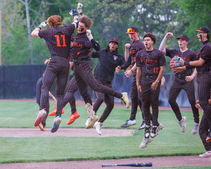 St. Charles East's Niko Vahmistrovs (11) celebrates after hitting a homer against St. Charles North on Monday May 4, 2026 in St. Charles.