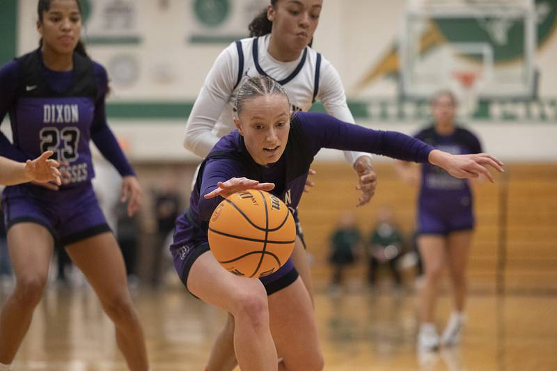 Dixon's Makenzie Toms reaches for a loose ball against Sterling Thursday, Feb. 27, 2025, during the Class 3A girls Sectional title at Rockford Boylan High School.