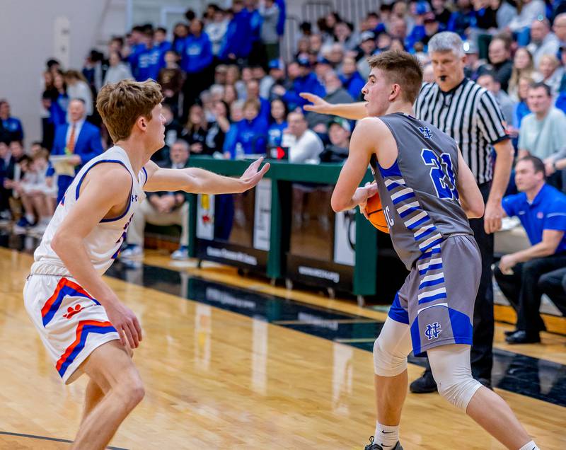 Newman senior Cody McBride looks to pass inside during the regional championship at West Carroll on Friday, February 28, 2025.