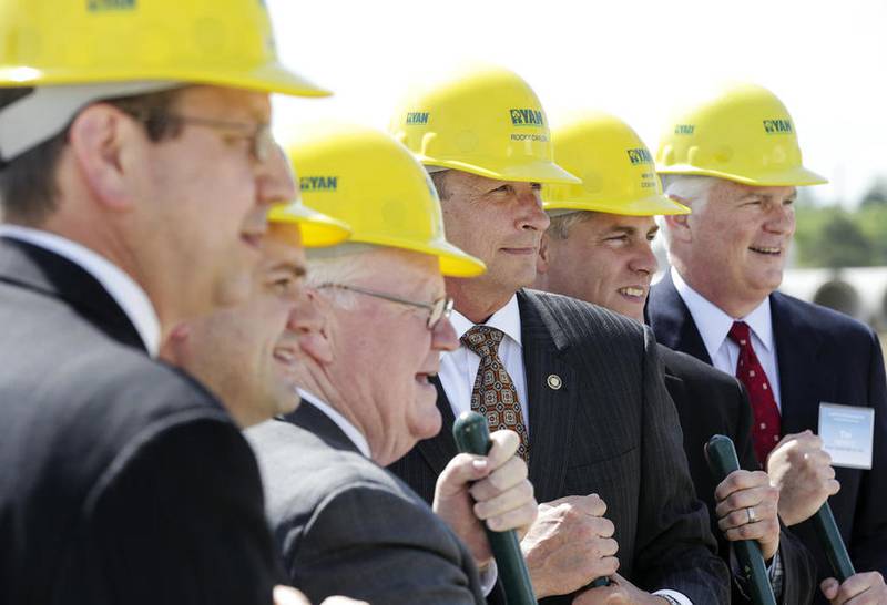 A group of elected officials and members of Cadence Premier Logistics pose for a photo Thursday during a groundbreaking ceremony at Laraway Crossings in Joliet.