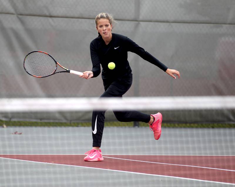 Ottawa Township’s Rylee O’Fallon reaches for the ball during a match with doubles partner Jenna Smithmeyer (not pictured) during the first day of the IHSA state tennis tournament at Palatine High School on Thursday, Oct. 20, 2022.