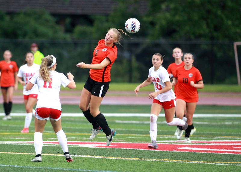 Crystal Lake Central’s Lizzie Gray (center) heads the ball during the Class 2A state championship game against Triad at North Central College in Naperville on Saturday, June 1, 2024.