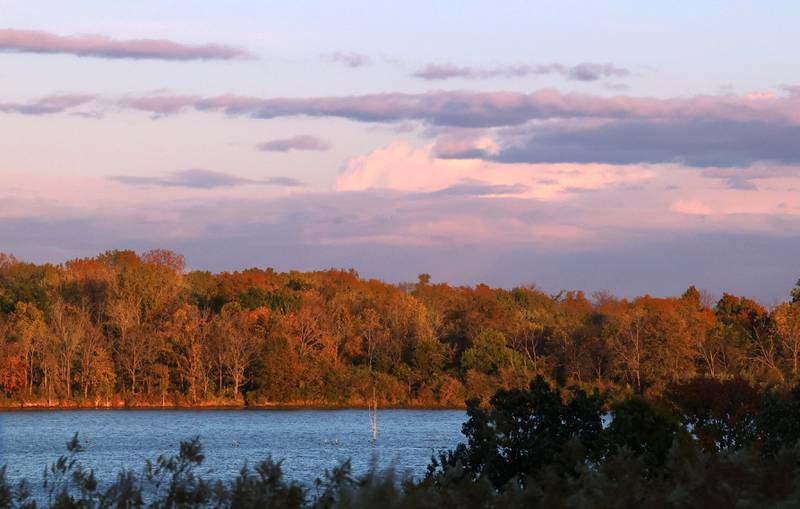 Clouds at sunset hang over the trees along Shabbona Lake Tuesday, Oct. 22, 2024, at Shabbona Lake State Park.