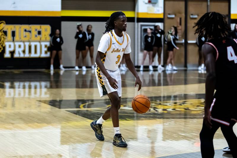 Joliet West's Deven Triplett sets goes on offense during a varsity boys basketball game against Minooka at Joliet West on Jan. 6, 2026.
