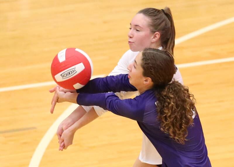 Plano's libero Angela Smithey backs up teammate Alexa Sobieszczyk on Thursday, Aug. 31, 2023 in Kingman Gym at Ottawa High School.