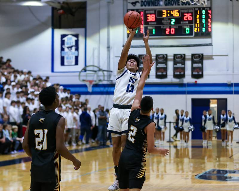 Downers Grove South's Richard Gasmen (13) shoots a jumper during basketball game between Hinsdale South at Downers Grove South. Dec 1, 2023.