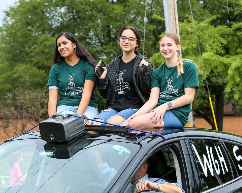 Students with the school radio station, WGHS, in the Glenbard West Homecoming Parade.  Sept 16, 2023