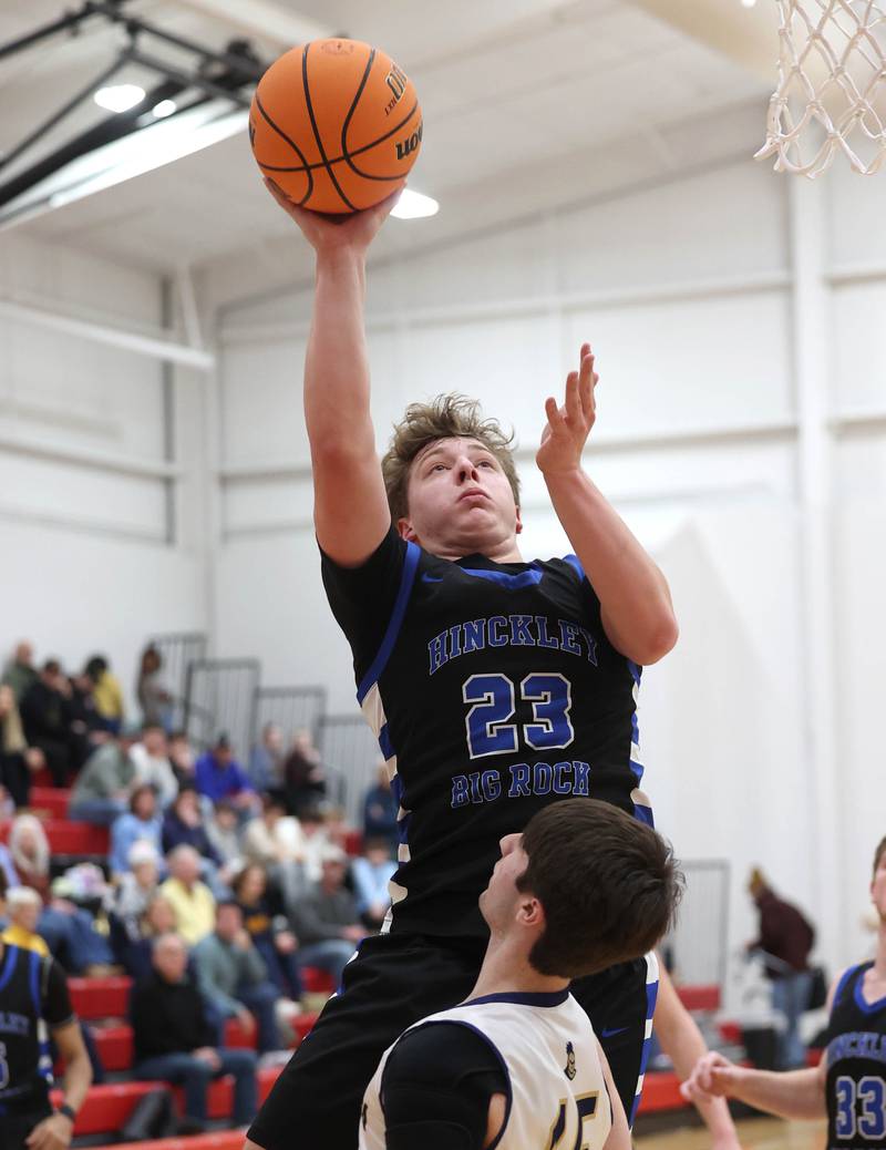 Hinckley-Big Rock's Luke Badal shoots over Marquette's Alec Novotney Tuesday, March 3, 2026, during their sectional semifinal matchup at Amboy High School.