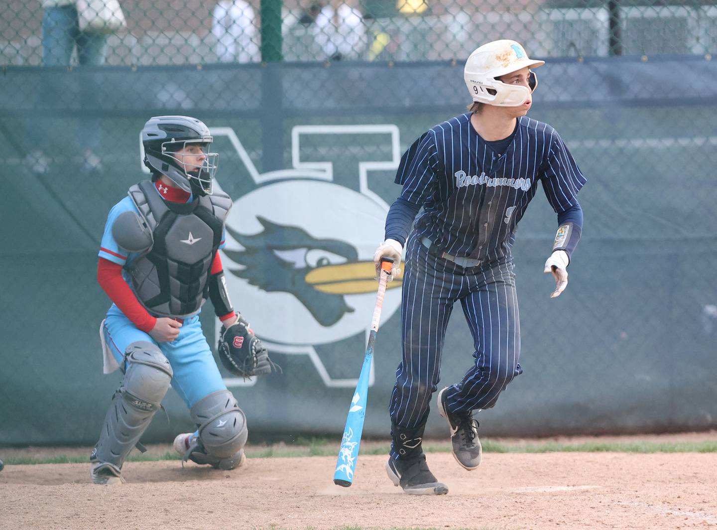 Nazareth's Nick Drtina (9) runs after making contact during the varsity baseball game between Benet Academy and Nazareth Academy in La Grange Park on Monday, April 24, 2023.