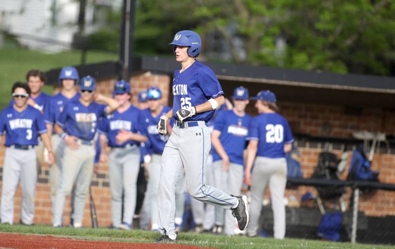 Wheaton North’s Charlie Strutzel heads to home plate following his homerun during a game at St. Charles East on Monday, May 15, 2023.