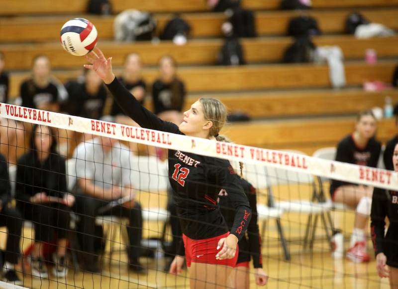 Benet’s Lynney Tarnow gets the ball over the net during a game against St. Charles North on Monday, Oct. 7, 2024 at Benet in Lisle.