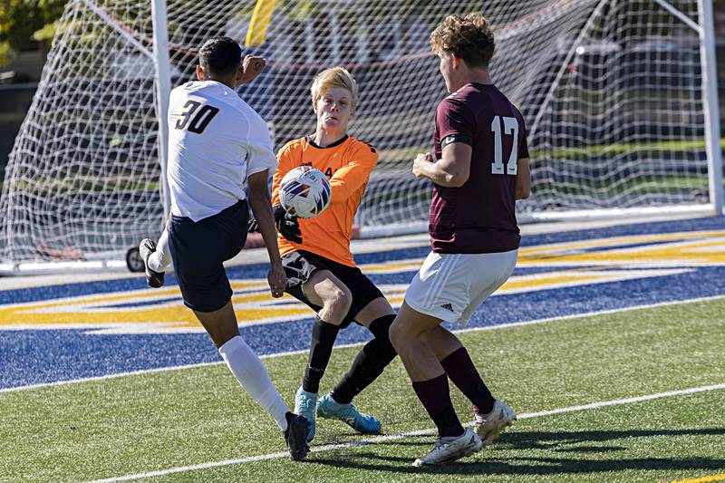 Sterling’s Felipe Sandoval crashes the net against Dunlap goalkeeper Joseph Heiar Saturday, Oct. 21, 2023 in the regional finals game in Sterling.