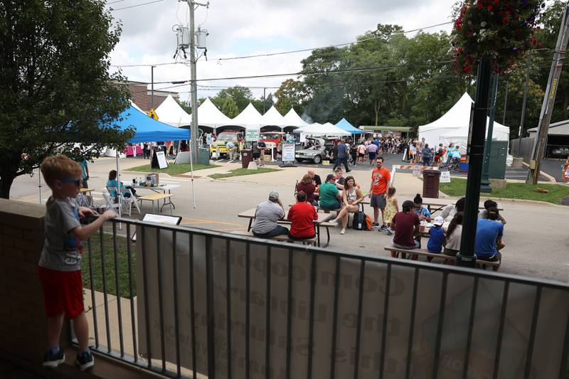 Tents for artist and vendors fill the parking lot of the White Oak Library District Lockport Branch at Comicolopis, Lockport’s 7th annual Comic and Fandom Con on Saturday, July 29.
