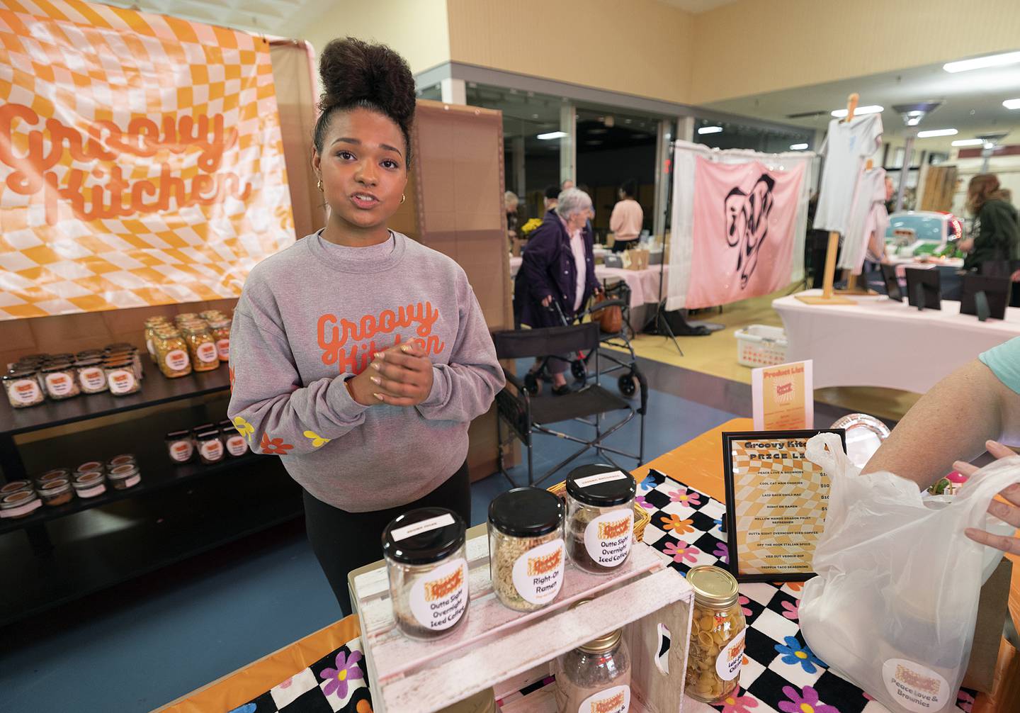 “Groovy Kitchen” owner/operator Destini Chambers of Newman High School describes her products Wednesday, April 24, 2024 at the CEO trade show. Chambers mixes food and drink spices into an easy to use jar for a quick  meal or beverage.