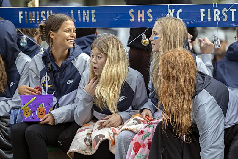 The Sterling cross country team checks out the sights from their homecoming float Friday, Oct.6, 2023.