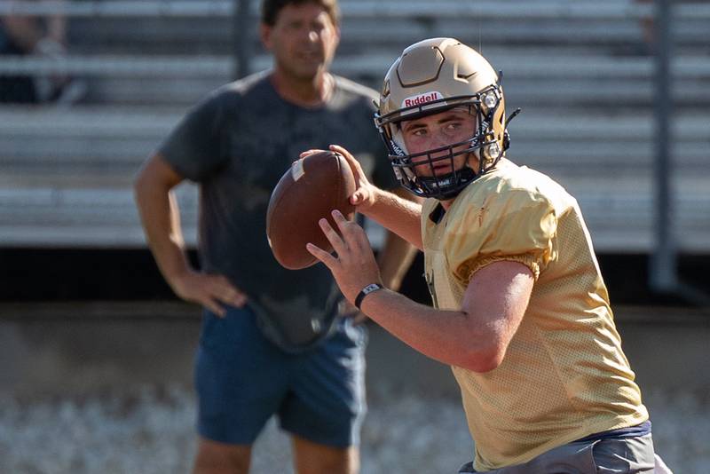 Anthony Couch of Marquette scans field before throw during scrimmage on Tuesday July 16, 2025 at Howard Fellows Stadium in LaSalle.