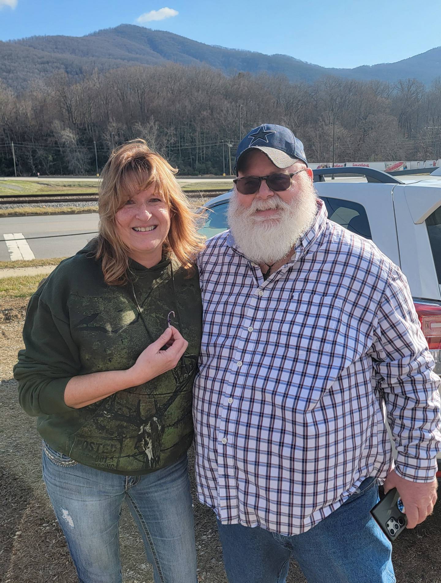 Diane Brokaw, left, with a North Carolina man she donated money to after he lost his home from Hurricane Helene.