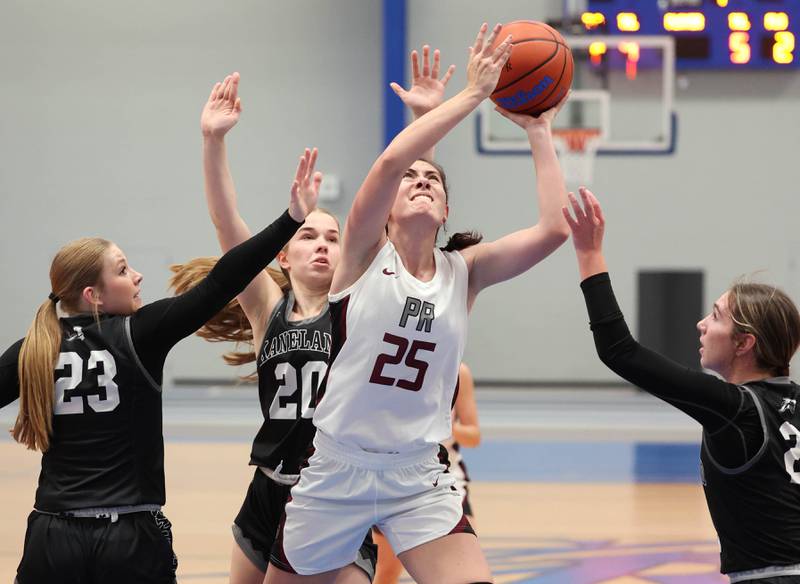 Prairie Ridge's Addie Meyer goes to the basket between three Kaneland defenders during their game Friday, Nov. 17, 2023, in the Mark Einwich Varsity Girls Basketball Rockets Kickoff Tournament at Burlington Central High School.