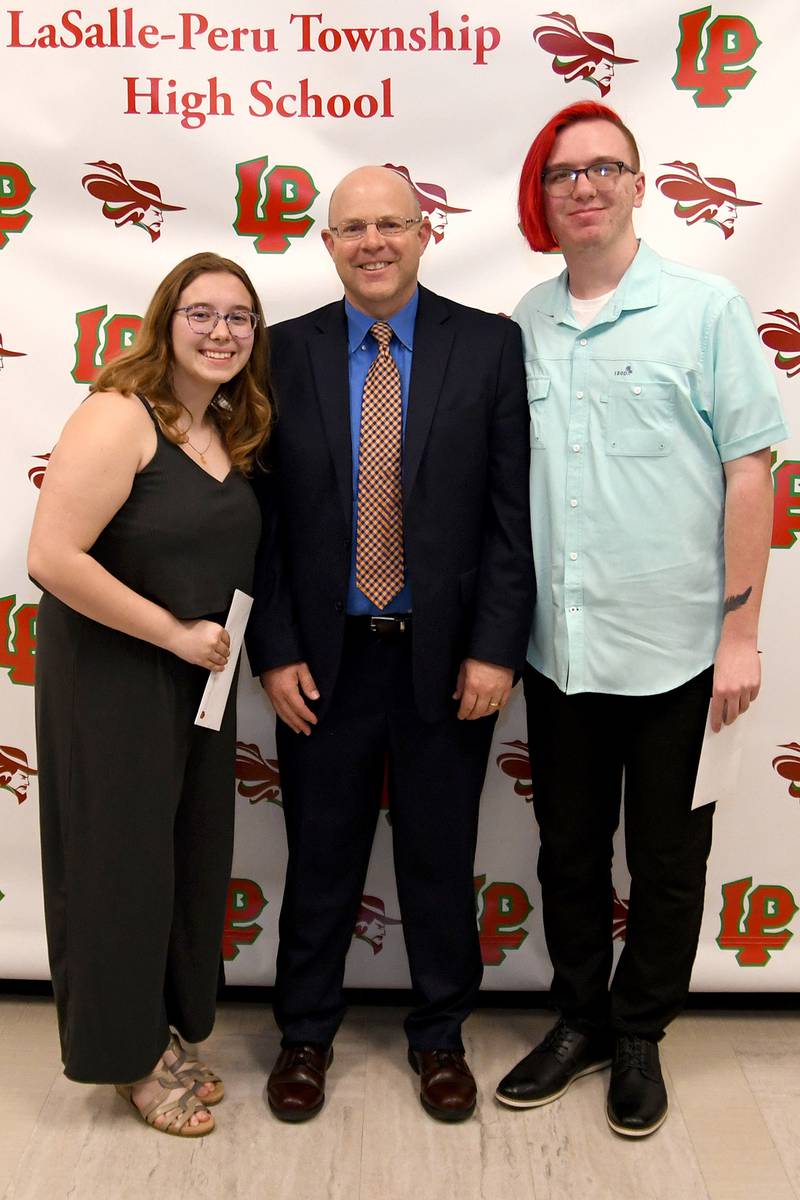 Caitlin Traub (left) and Jaxon Schneider (right) received the L-P Band Parents Association Scholarship, presented by Chris Vaske (middle). This $1,000 scholarship was established to reward the time and education given to creating music for the community to enjoy. The scholarship is awarded to two graduating L-P seniors who have participated in band for four years, have a minimum GPA of 2.0 and completed an essay on how band participation helped shape them into the people they are.