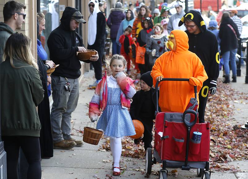 Trick or treaters make their way around the Woodstock Square during Halloween on the Square on Thursday, Oct. 31, 2024, in Woodstock.