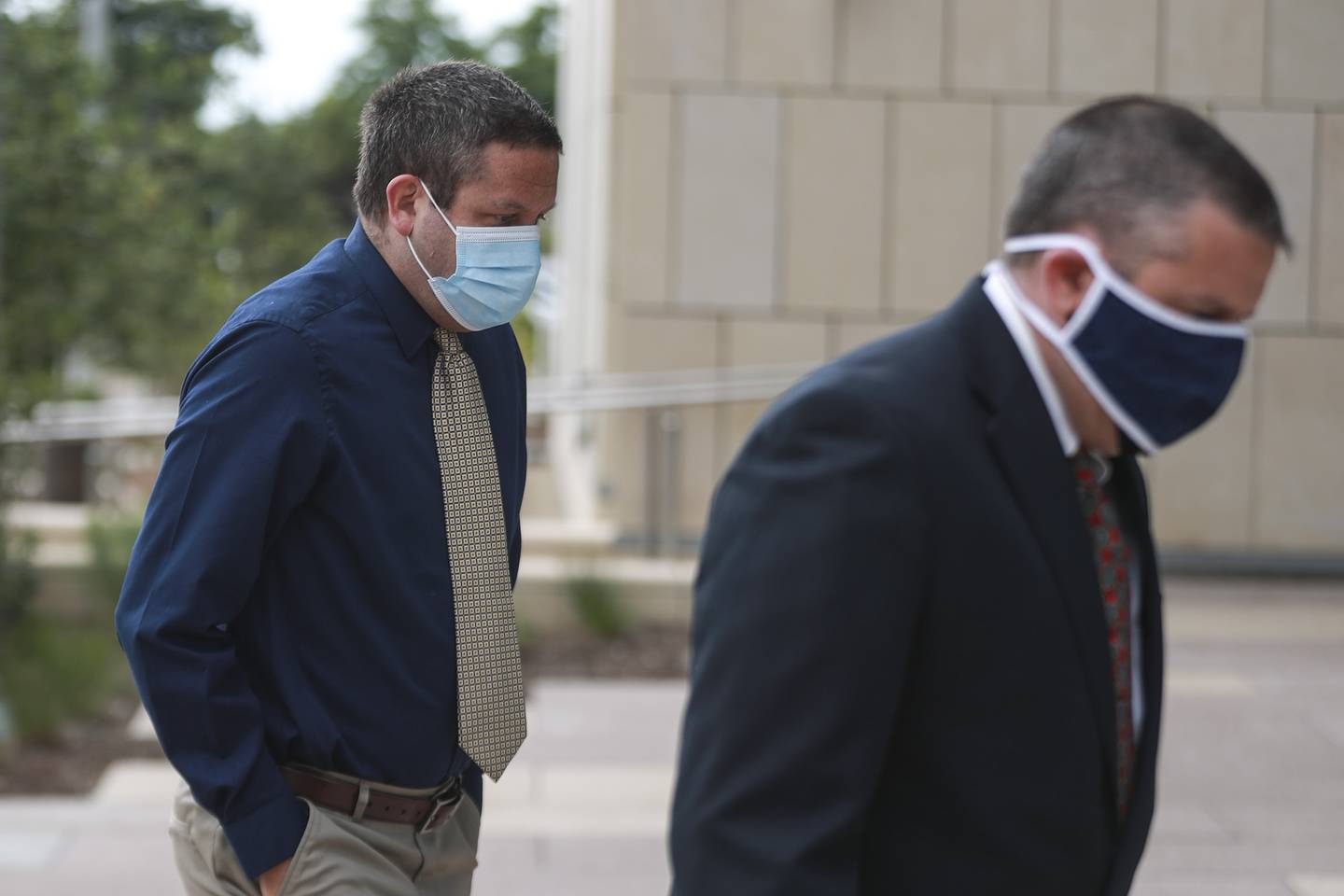 Jeremy Hylka (left) enters the courthouse ahead of his arraignment on Thursday, June 24, 2021, at Will County Court House in Joliet, Ill.