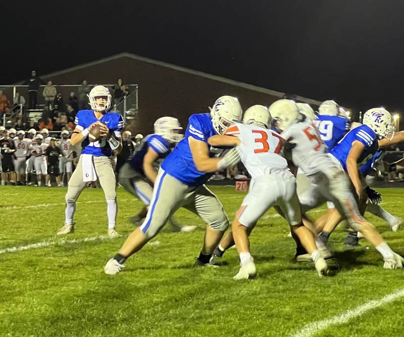 Burlington Central quarterback Landon Arnold looks for a receiver during Friday's game with McHenry.