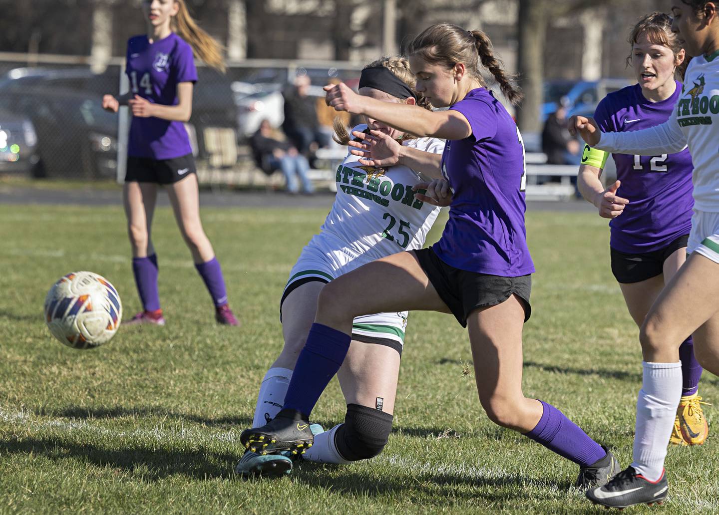 Dixon’s Leah Stees works against North Boone’s Kayla Stamm Thursday, April 6, 2023.