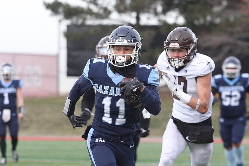Nazareth’s James Penley takes a catch upfield against Joliet Catholic in the Class 5A state championship on Saturday, Nov. 30, 2024 in Normal.