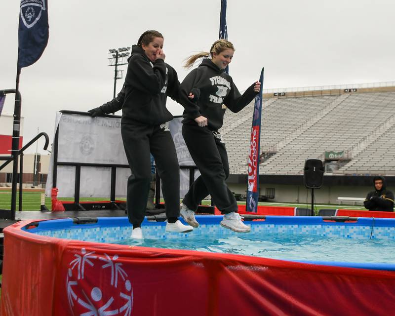 Participants take the plunge during the Polar Plunge event on Saturday Feb. 21, 2026, held at Huskie Stadium in DeKalb.