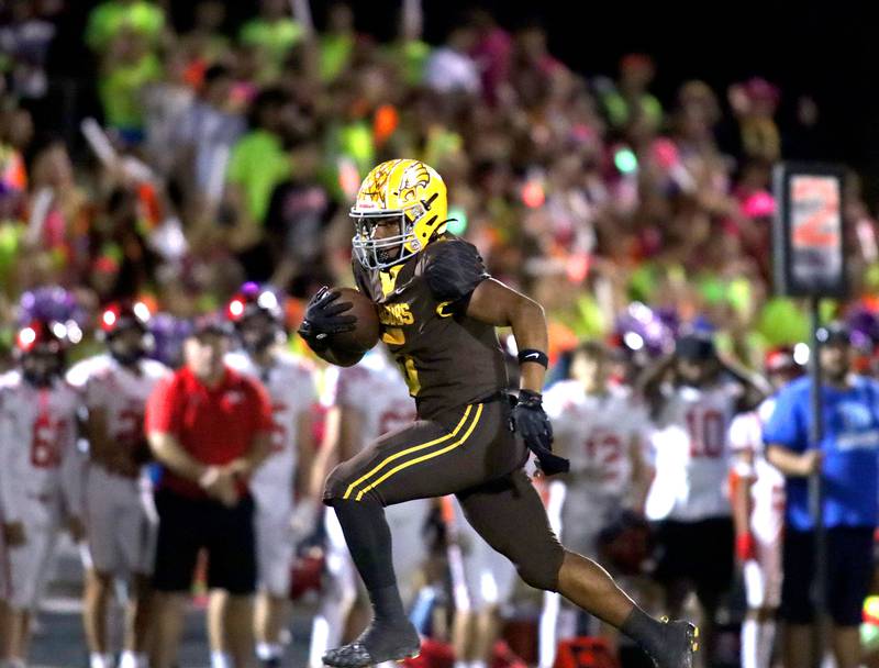 Jacobs’ Michael Cannady finds an open field on a long touchdown run against Huntley in varsity football at Jacobs High School in Algonquin on Friday, Sept. 26, 2025.
