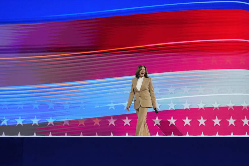 Democratic presidential nominee Vice President Kamala Harris walks onto stage during the first day of Democratic National Convention, Monday, Aug. 19, 2024, in Chicago. (AP Photo/Jacquelyn Martin)