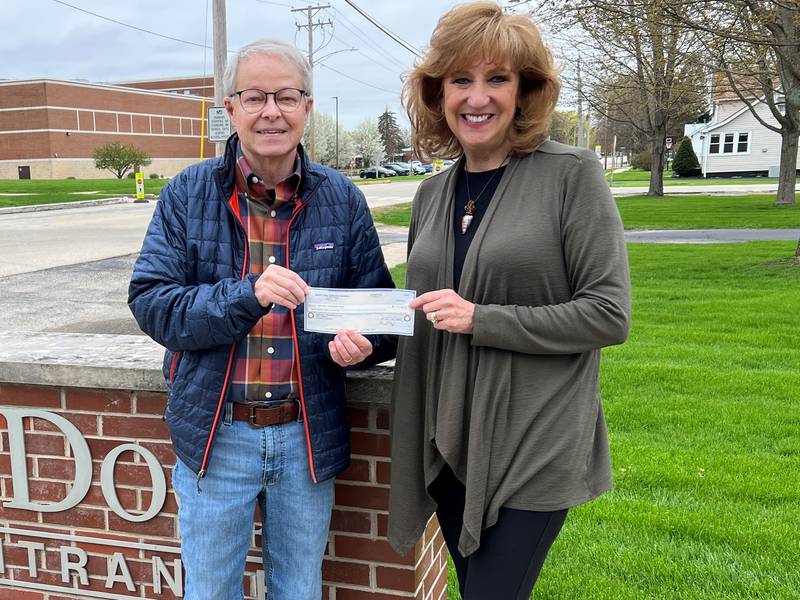 Pictured (left to right): DCCF board member Mike Constance presenting the $12,000 check to Open Door Program Coordinator Laurie Wisdom