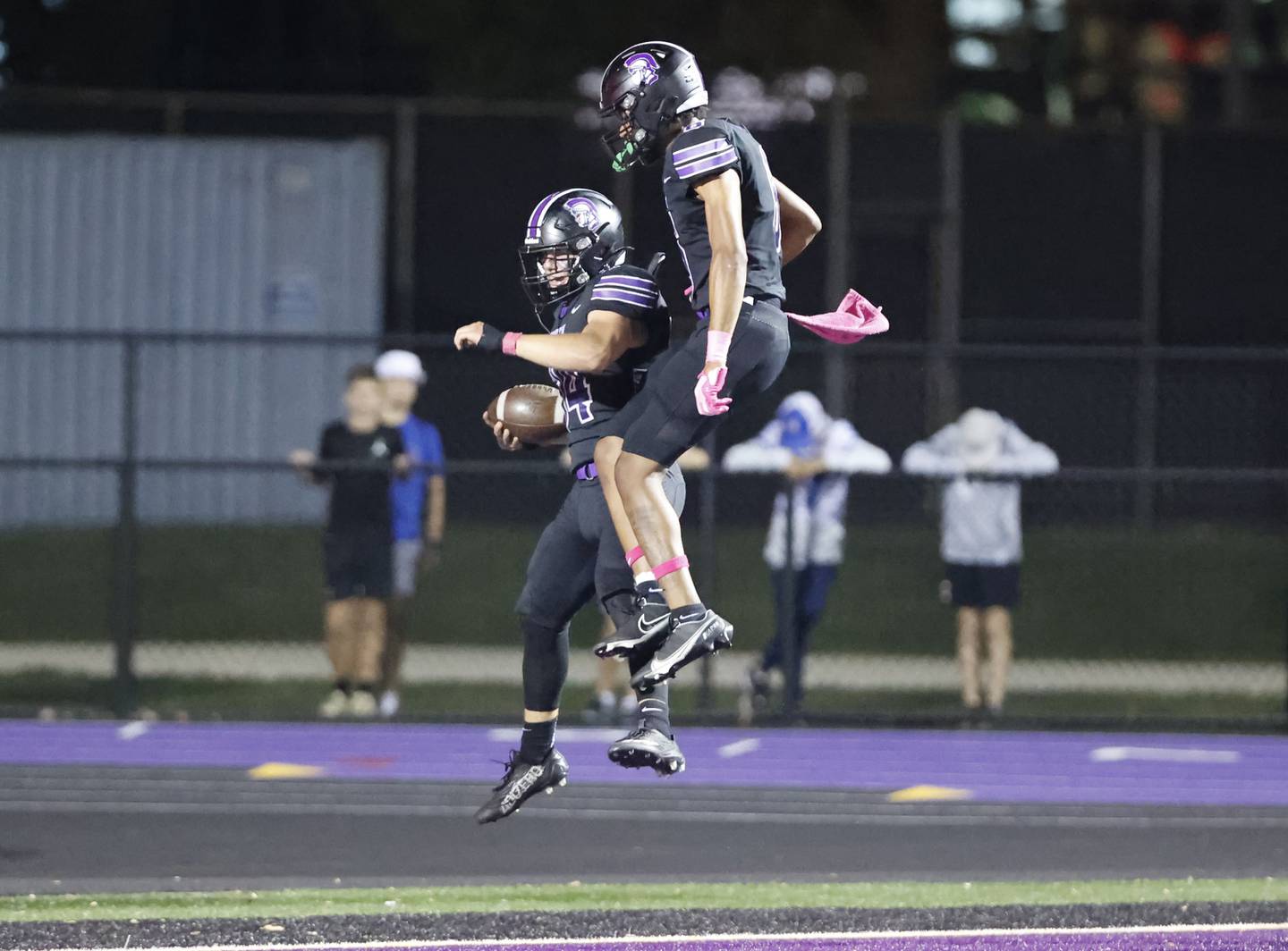 Downers Grove North's Jake Gregorio (34) celebrates scoring a touchdown during the varsity football game between Downers Grove North and Lyons Township on Friday, Oct. 11, 2024 in Downers Grove.
