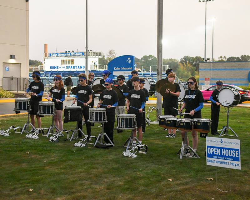 St. Francis’s drum line preforms outside of the stadium before the start of the game on Friday Oct. 3, 2025, held at St. Francis High School.