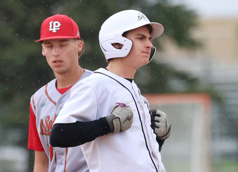Kaneland's Kanon Baxley celebrates at second base after an run-scoring hit Tuesday, May 12, 2026, during their game against La Salle-Peru at Kaneland High School in Maple Park.